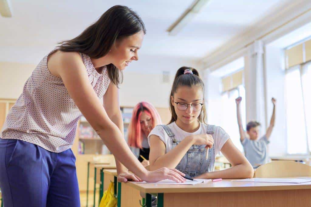 young woman teacher teaches lesson in class of tee 2022 02 22 04 30 51 utc